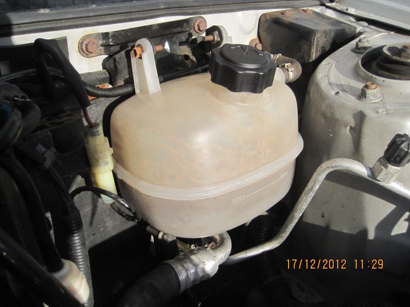 "Gunky stuff" in coolant expansion tank. Forums